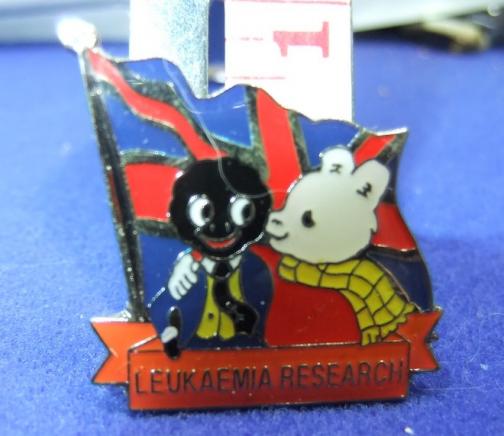 Golly and Rupert leukaemia research pin orange scroll