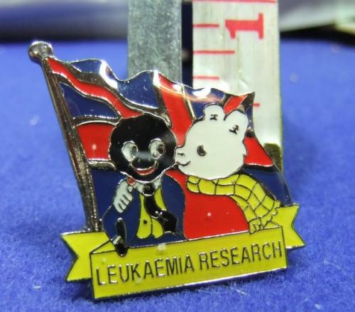 Golly and Rupert leukaemia research pin yellow scroll